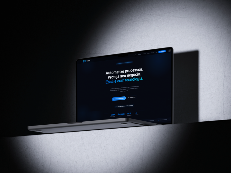 MacBook in a dark room showing the NV Tech Solutions home page